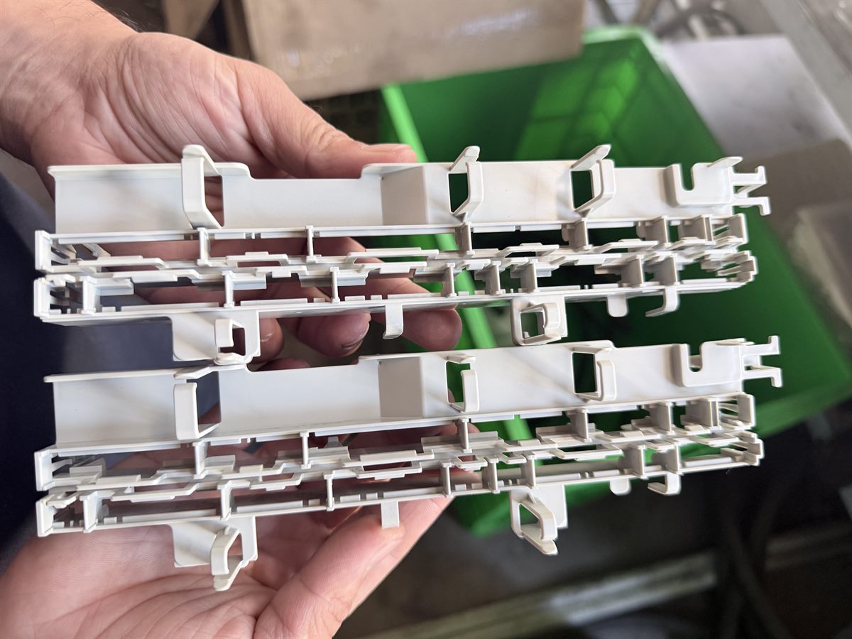 Molded plastic components showing internal ribs, walls, and assembly features