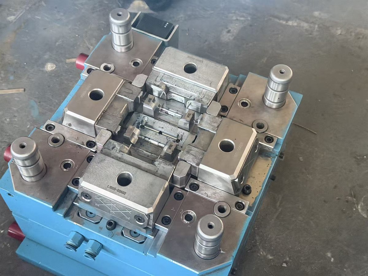 Open injection mold showing tooling components